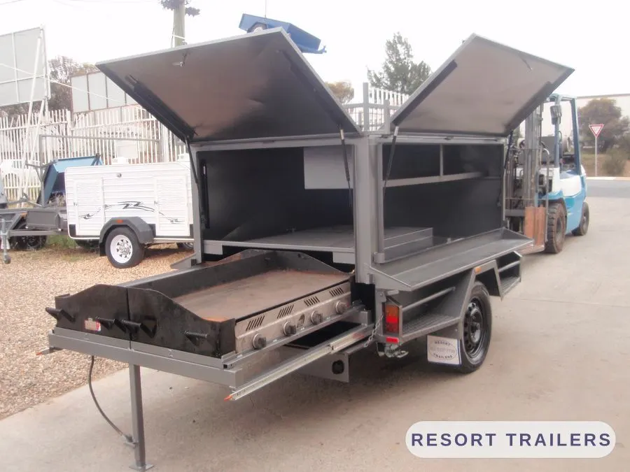 Gull-wing BBQ trailer with a six-burner hotplate — built by Resort Trailers