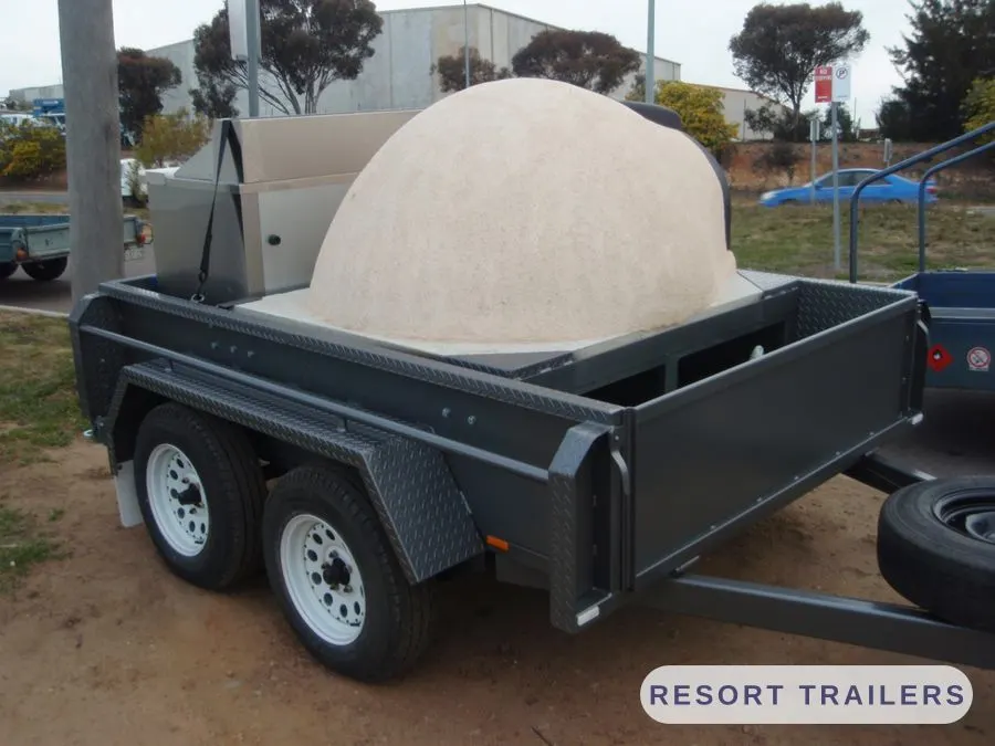 Pizza oven dome set into a custom trailer body — built by Resort Trailers