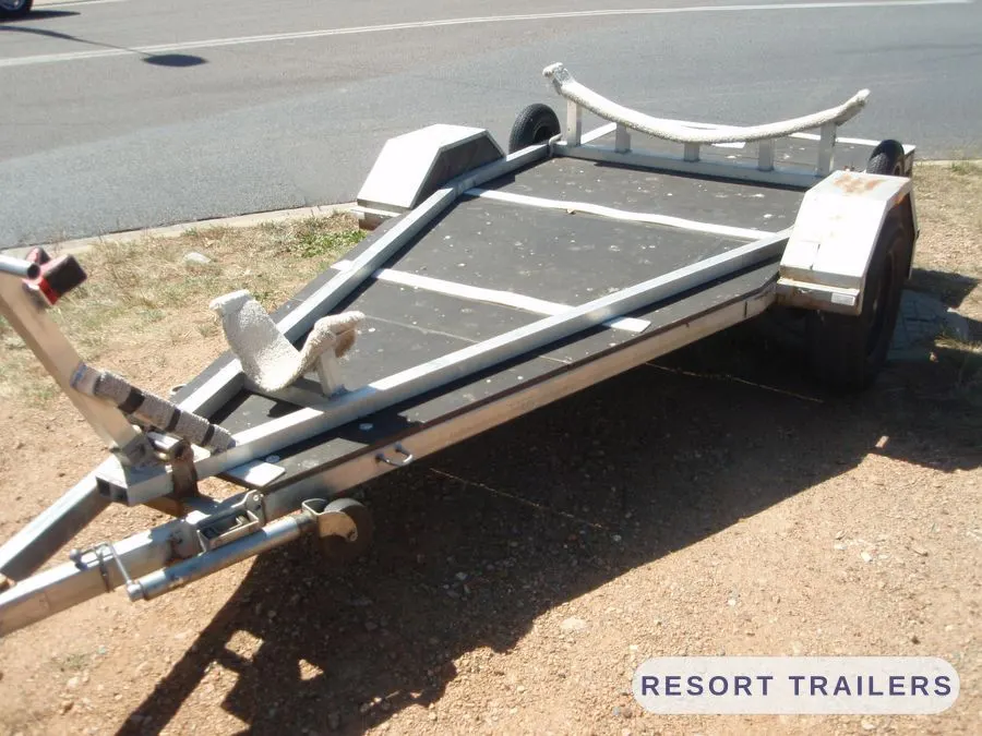 Alloy boat trailer from the front, showing the bunks and bow support — built by Resort Trailers