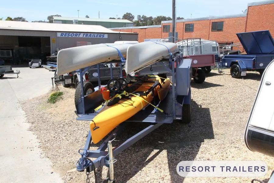 Multi-kayak trailer on the yard outside the Resort Trailers workshop — built by Resort Trailers