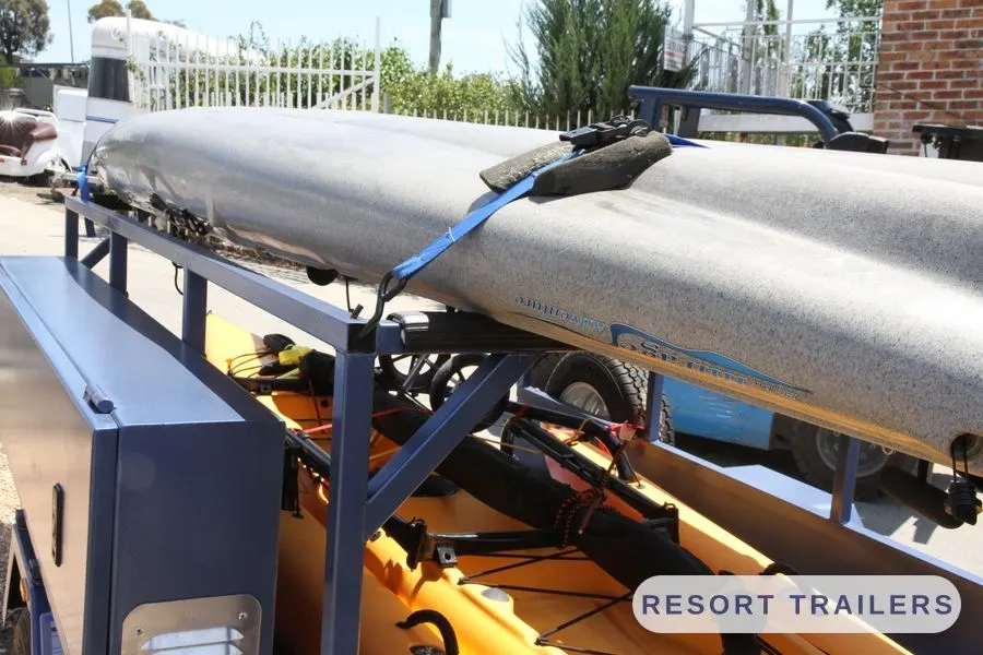 Overhead kayak rack with ratchet straps — built by Resort Trailers