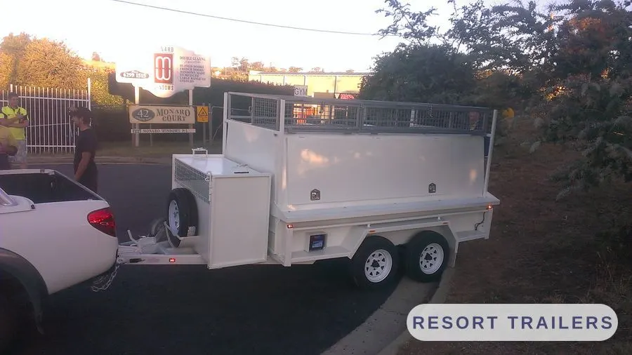 Canopy trailer with roof rack and side toolbox — built by Resort Trailers