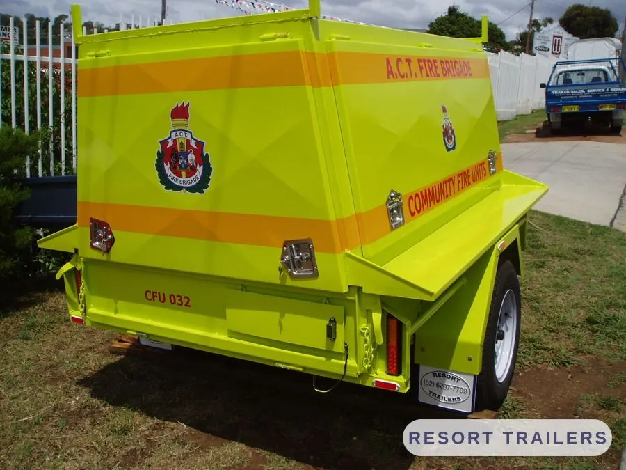 Fire unit trailer with lift-up side and mesh cage — built by Resort Trailers