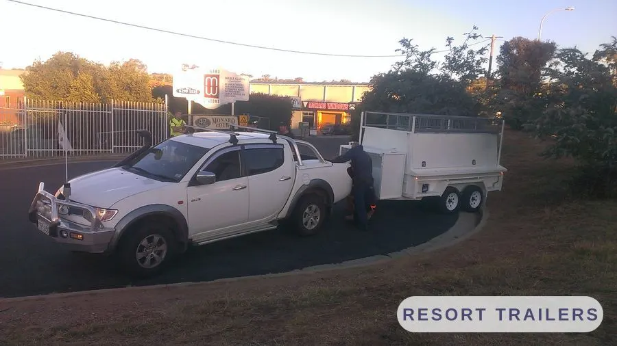 Trade trailer with canopy and roof rack, rear three-quarter — built by Resort Trailers