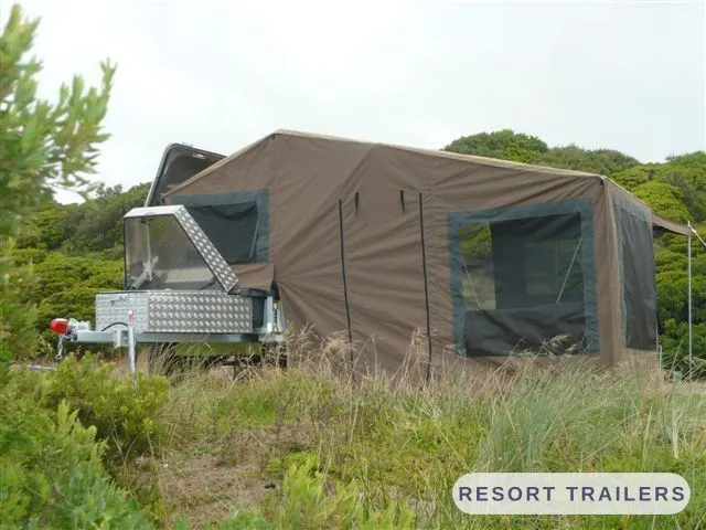 Camper trailer pitched in coastal scrub — built by Resort Trailers