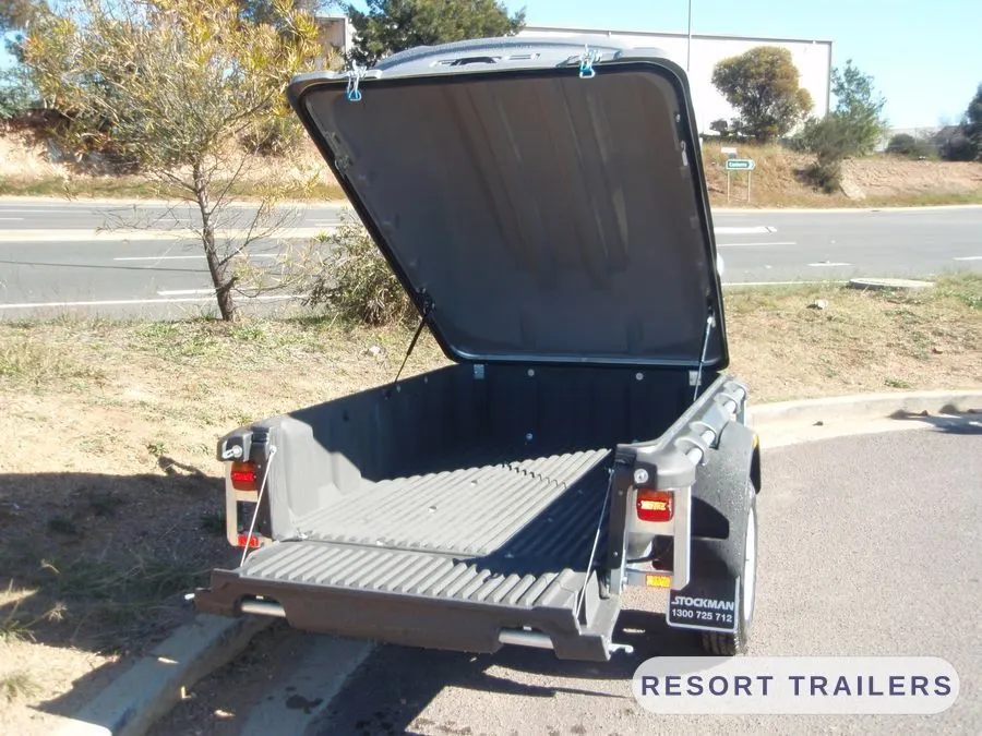 Pod trailer open, showing the slide-out storage tray — built by Resort Trailers