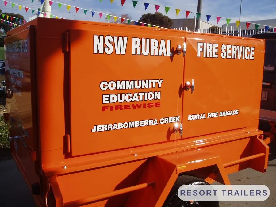 Enclosed community education trailer in service orange — built by Resort Trailers