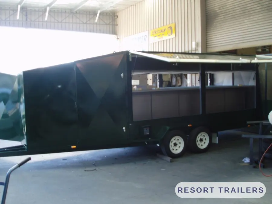 Enclosed trailer with hardtop roof, side view — built by Resort Trailers