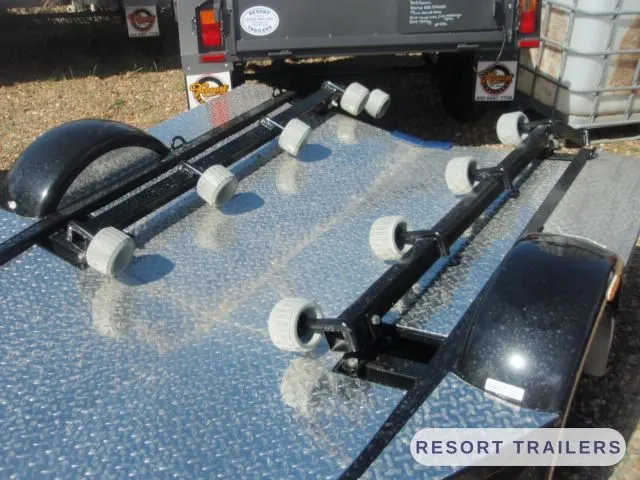 Close-up of the adjustable roller brackets — built by Resort Trailers