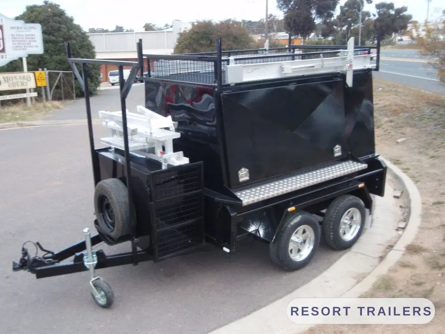 Black tandem tradie canopy with roof racks and a side toolbox — built by Resort Trailers