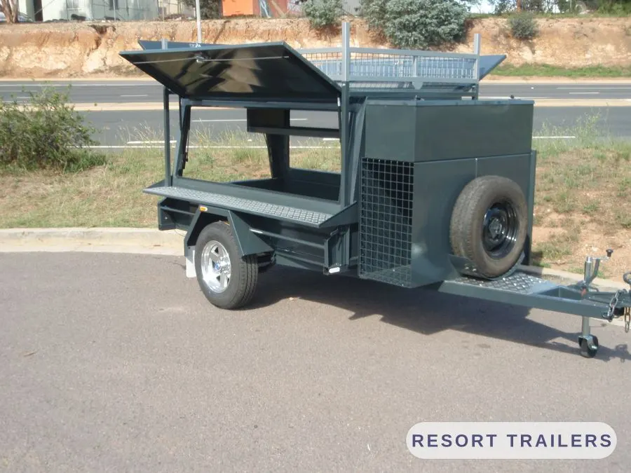 Canopy trailer opened up, showing the shelving inside — built by Resort Trailers