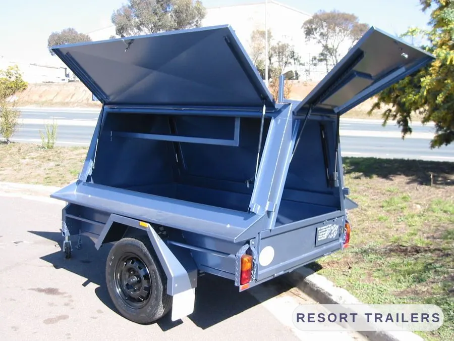 Gull-wing canopy open on both sides — built by Resort Trailers