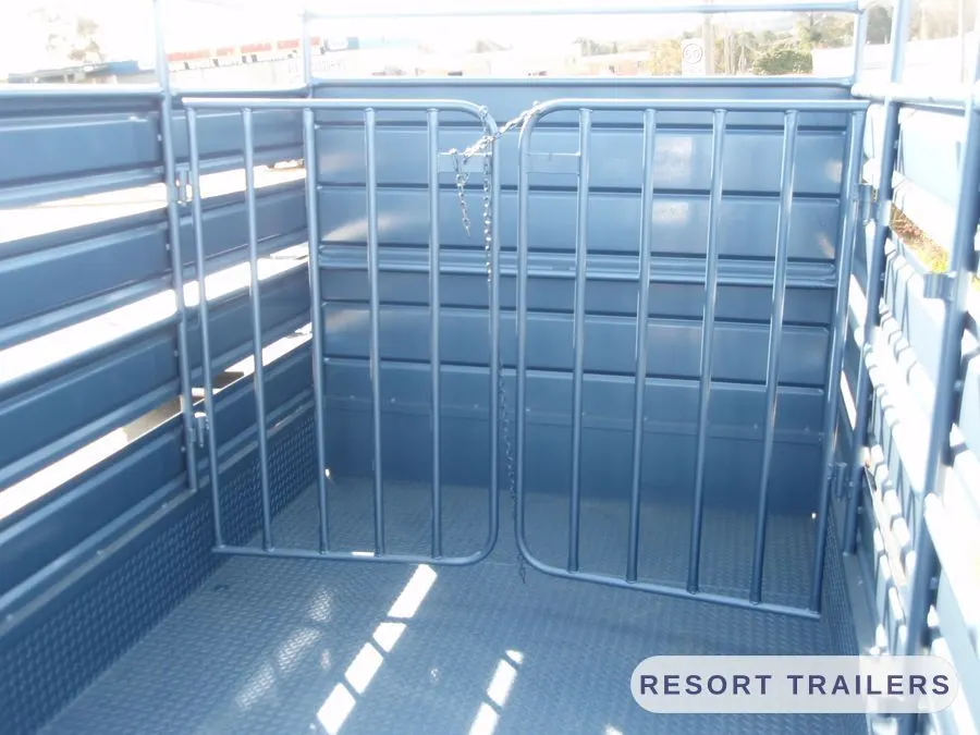 Internal dividing gates inside a stock crate — built by Resort Trailers