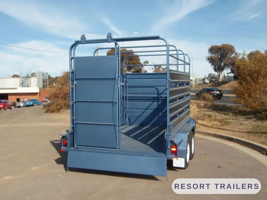 Rear gate part open on a tandem stock crate — built by Resort Trailers