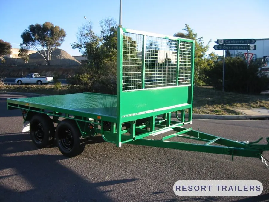 Green table top with a mesh headboard, front three-quarter — built by Resort Trailers