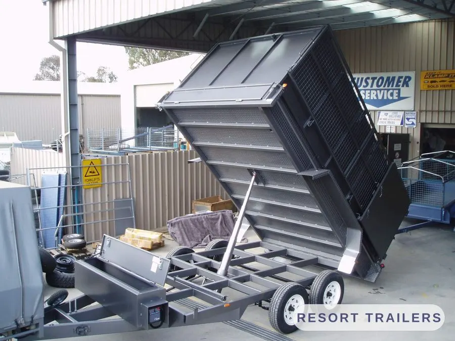 Dual-axle custom tipper built for trash-pack work — built by Resort Trailers