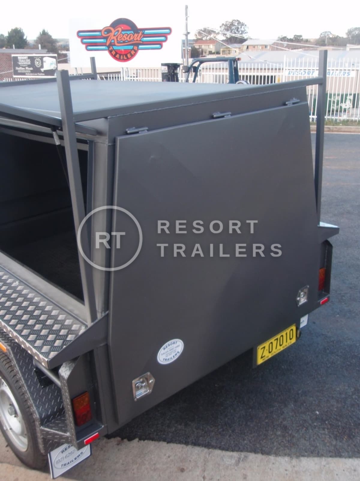 Dual axle tradesman trailer with large site box and roof racks back view — built by Resort Trailers