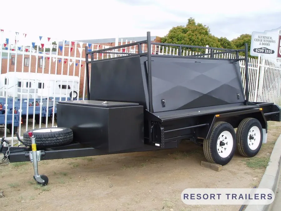 Tandem trade trailer with lift-up canopy lid — built by Resort Trailers