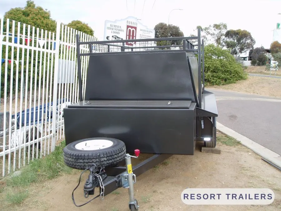 Trade trailer with toolbox and spare wheel on the drawbar — built by Resort Trailers